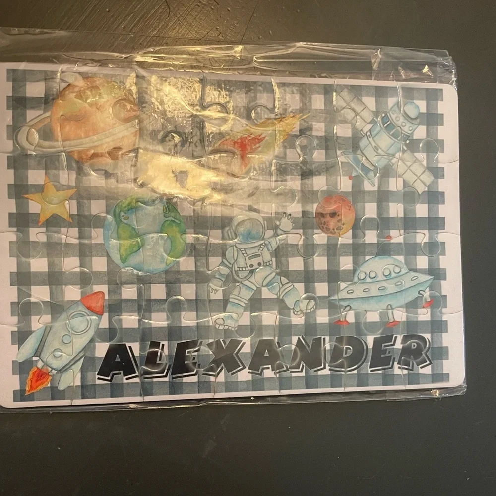 Space-Themed Puzzle with Astronauts and Planets with Alexander on it